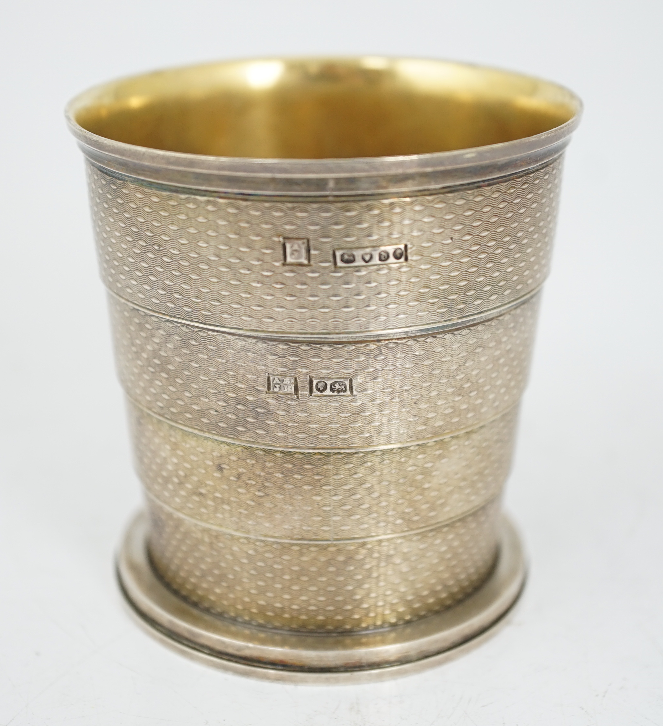 ROYAL INTEREST: A cased Victorian textured silver collapsible travelling cup, by Brownett & Rose, with later engraved inscription, 'Presented By Her Royal & Imperial Highness The Duchess of Saxe Coburg & Gotha Duchess of